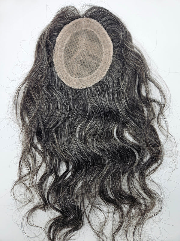 Close-up of natural black and silver gray blend on lace base hair topper