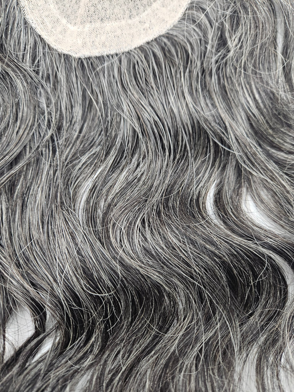 Close-up of natural black and silver gray blend on lace base hair topper