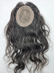 Close-up of natural black and silver gray blend on lace base hair topper