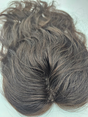 Close-up of brunette Remy hair on lace base topper