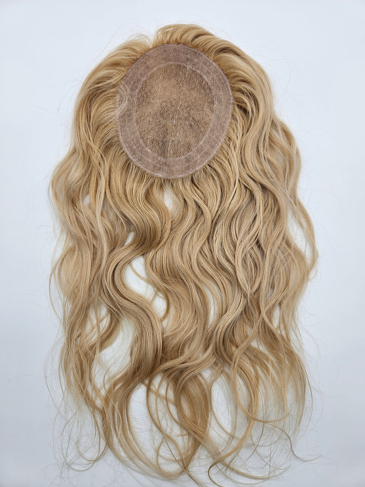 Close-up of #18 and #613 blended blonde highlights on lace base hair topper