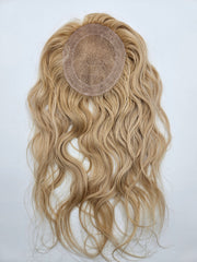 Close-up of #18 and #613 blended blonde highlights on lace base hair topper